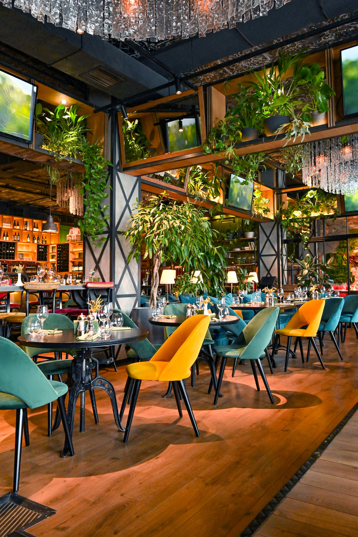 Green and Yellow Chairs and Tables in Restaurant Interior